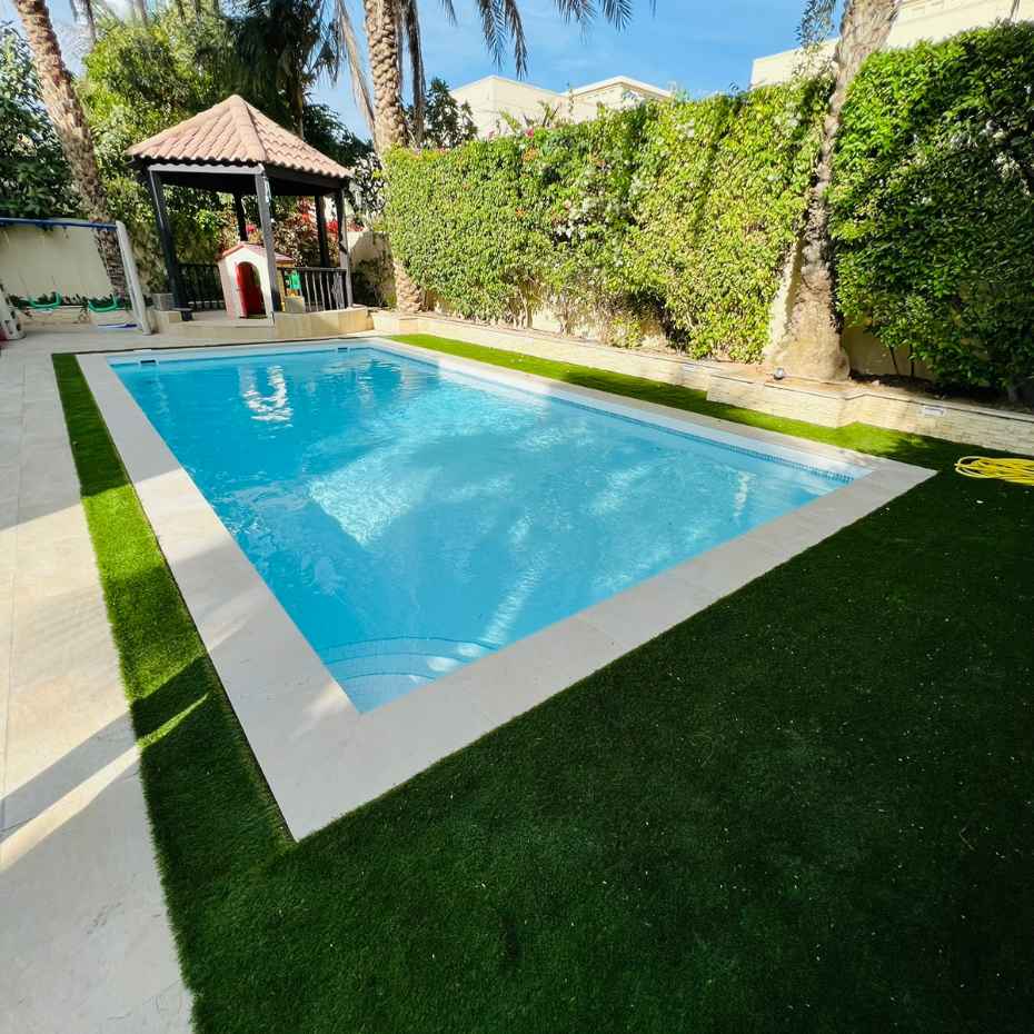 Pool Surrounding With Artificial Grass Creates An Everlasting Look - Elixir, The Perfect Choice For Swimming Pool Tiles And Artificial Grass In Dubai
