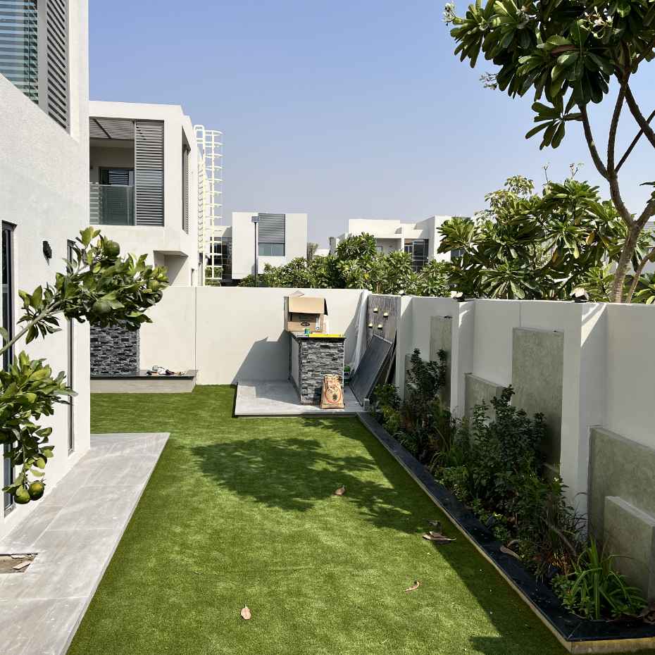 Outdoor Side Of Villa Enhanced With Artificial Grass