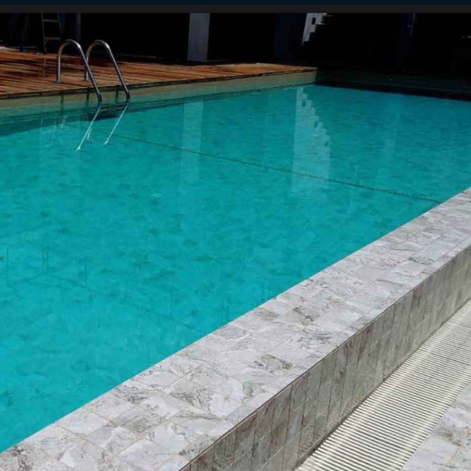 Swimming Pool Made with Alpine Beige 100x100 Swimming Pool Tile Mosaics in Dubai, UAE.