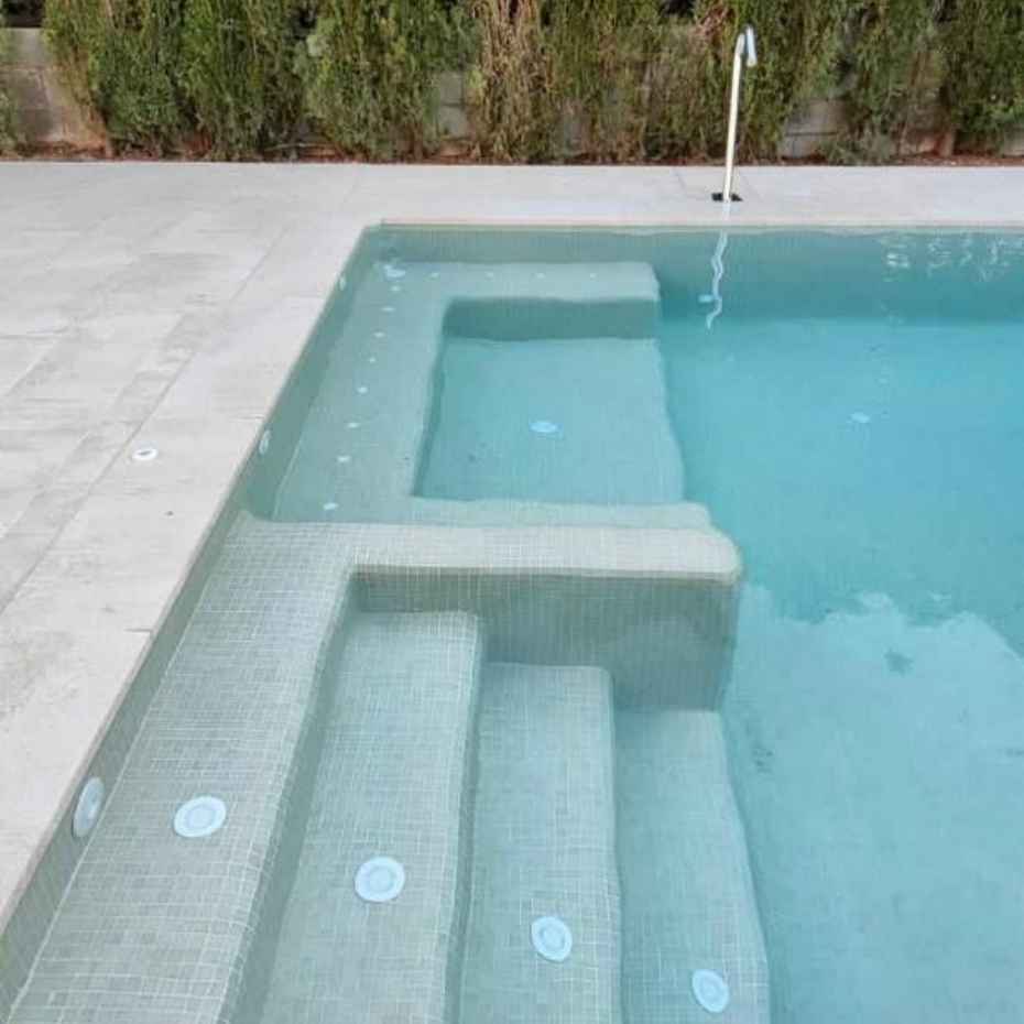 Front View Of A Pool With Beautiful Swimming Pool Tile Steps Made With EGM-300 Light Brown Glass Mosaic Pool Tiles