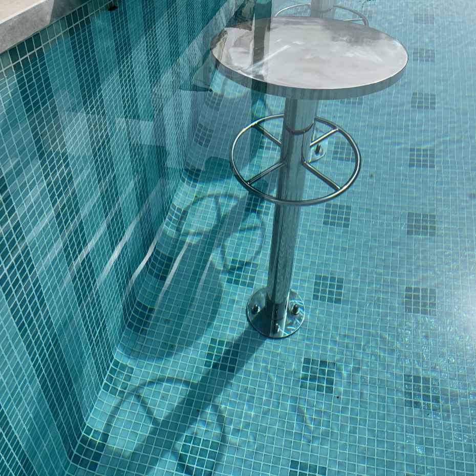 Seating Stool Fitted With EGM-201 Light Green Glass Mosaic Swimming Pool Tiles, Enhancing The Beauty Of The Pool.