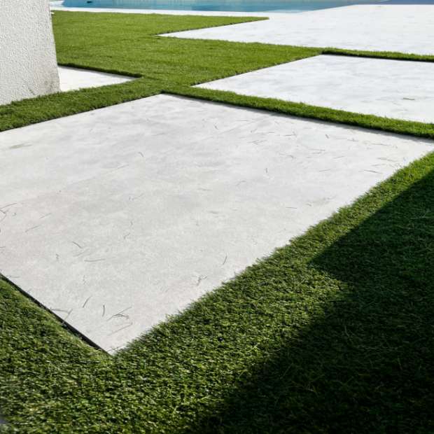 Fake Grass Combined With Outdoor Tiles For An Elegant Appearance