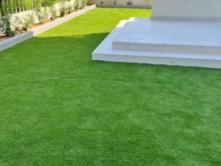 Outdoor installation of artificial grass in Dubai, UAE.