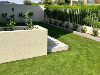 Artificial grass in a garden setting in Dubai, UAE.