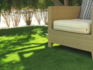Synthetic grass in the outdoor area offers an eco-friendly space for relaxing outdoors.