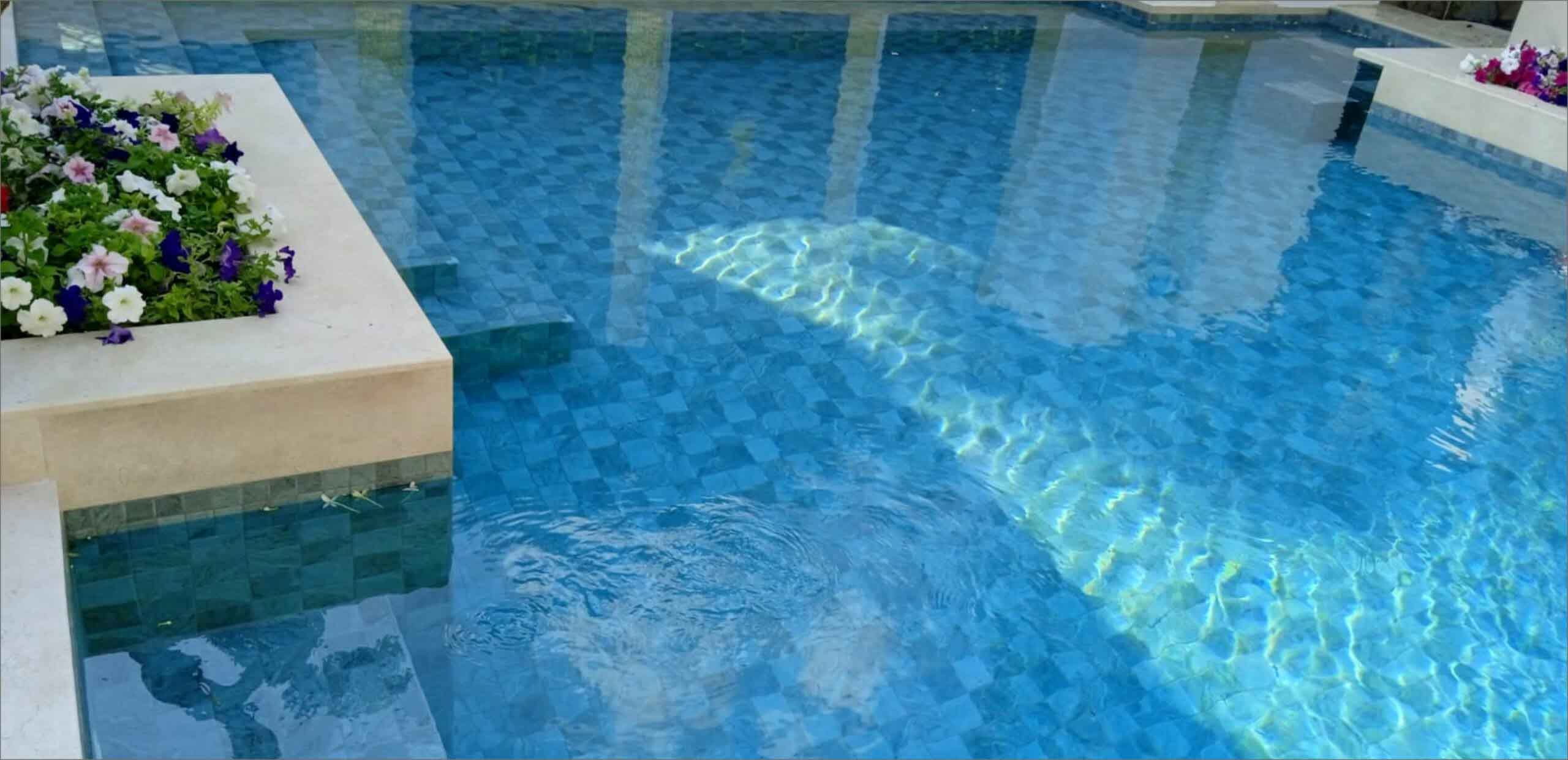Swimming pool made with Alpine Green 100 × 100 Mosaic Pool tiles.