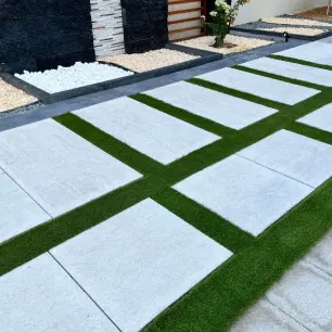 Artificial grass has been installed on the walkway